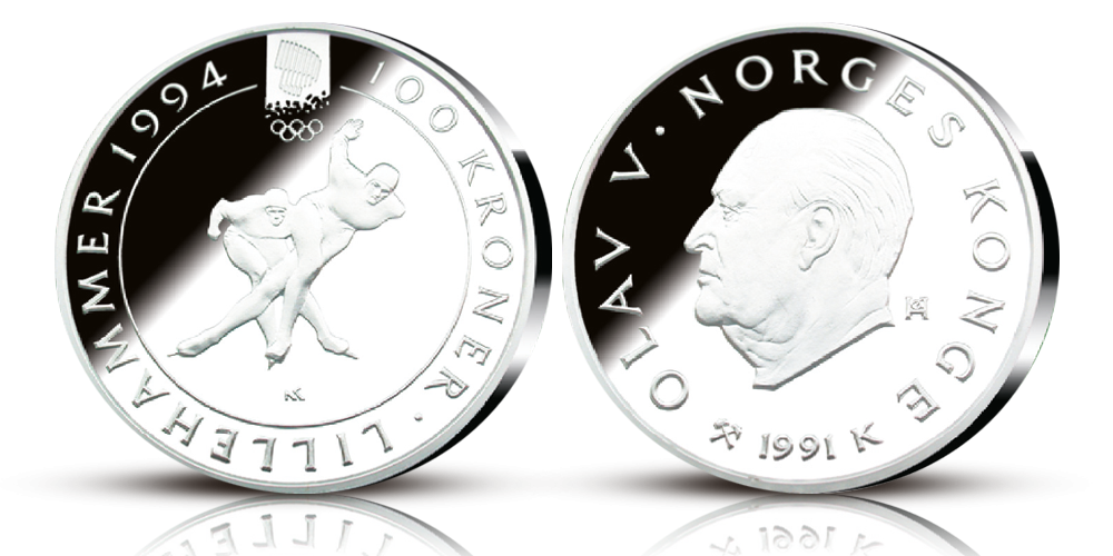 OL sølvmynt nr. 2 100 kroner 1991. Advers side av minnemynten viser et portrett av Kong Olav V og har randskriften, Olav V, Norges Konge 1991. Revers side av minnemynten har motiv av to skøyteløpere og randskriften 100 kroner, Lillehammer 1994. 